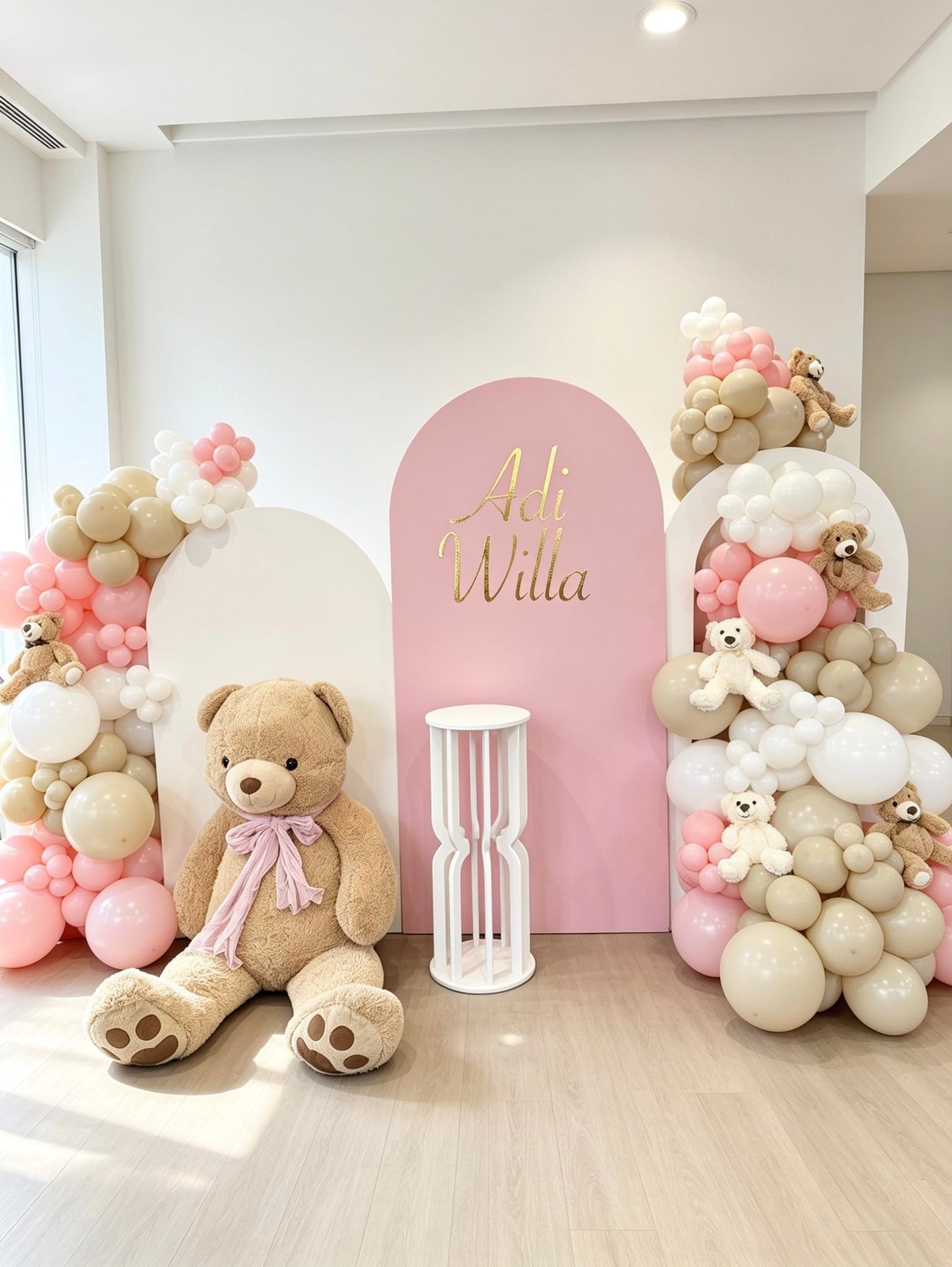 Teddy Bear baby shower backdrop with three custom backdrops, blush and beige balloon garlands, plush teddy bear and white pedestal stand.