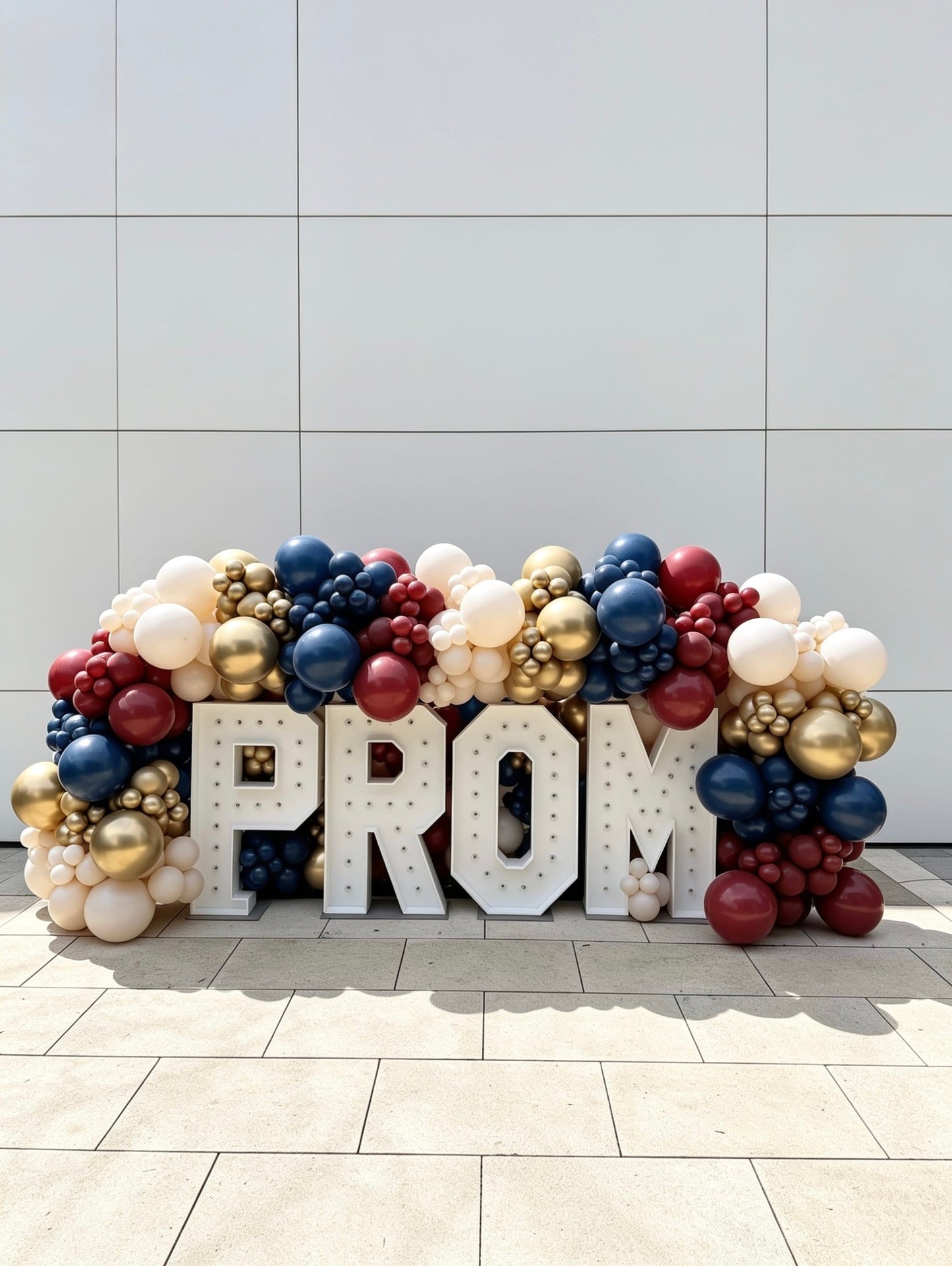 Illuminated PROM marquee letters with navy blue, burgundy red, ivory and gold organic balloon garland