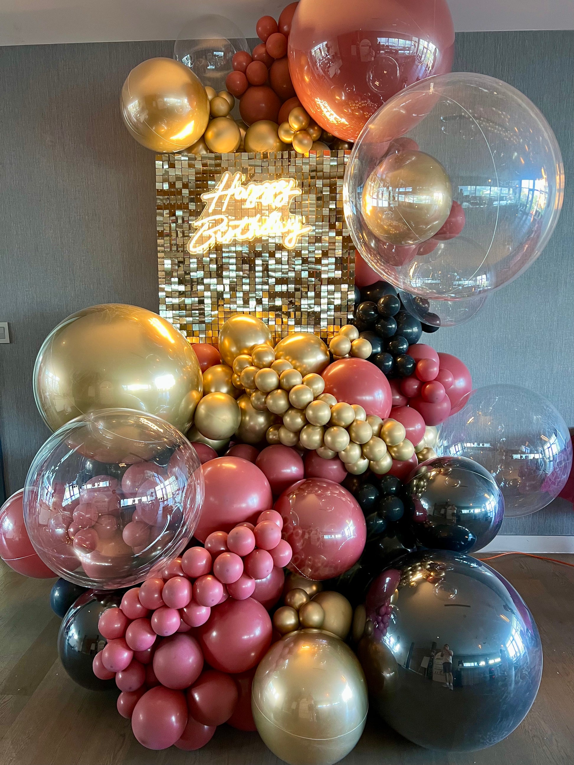 luxury shimmer wall birthday backdrop with large balloon arrangement
