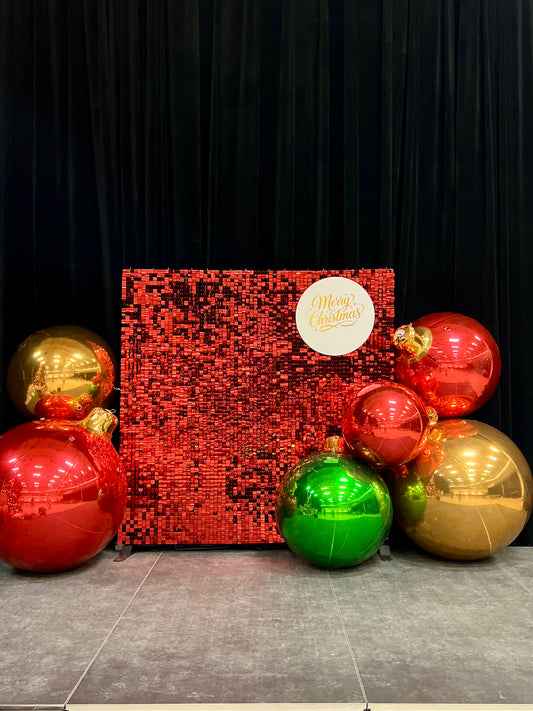 christmas shimmer wall with giant pvc balloons and holiday decor
