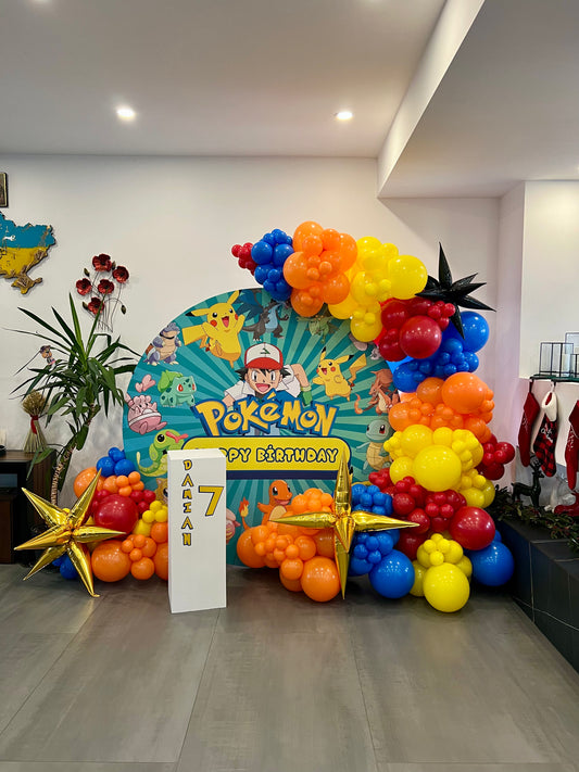 pokemon birthday balloon backdrop with themed garland and round panel