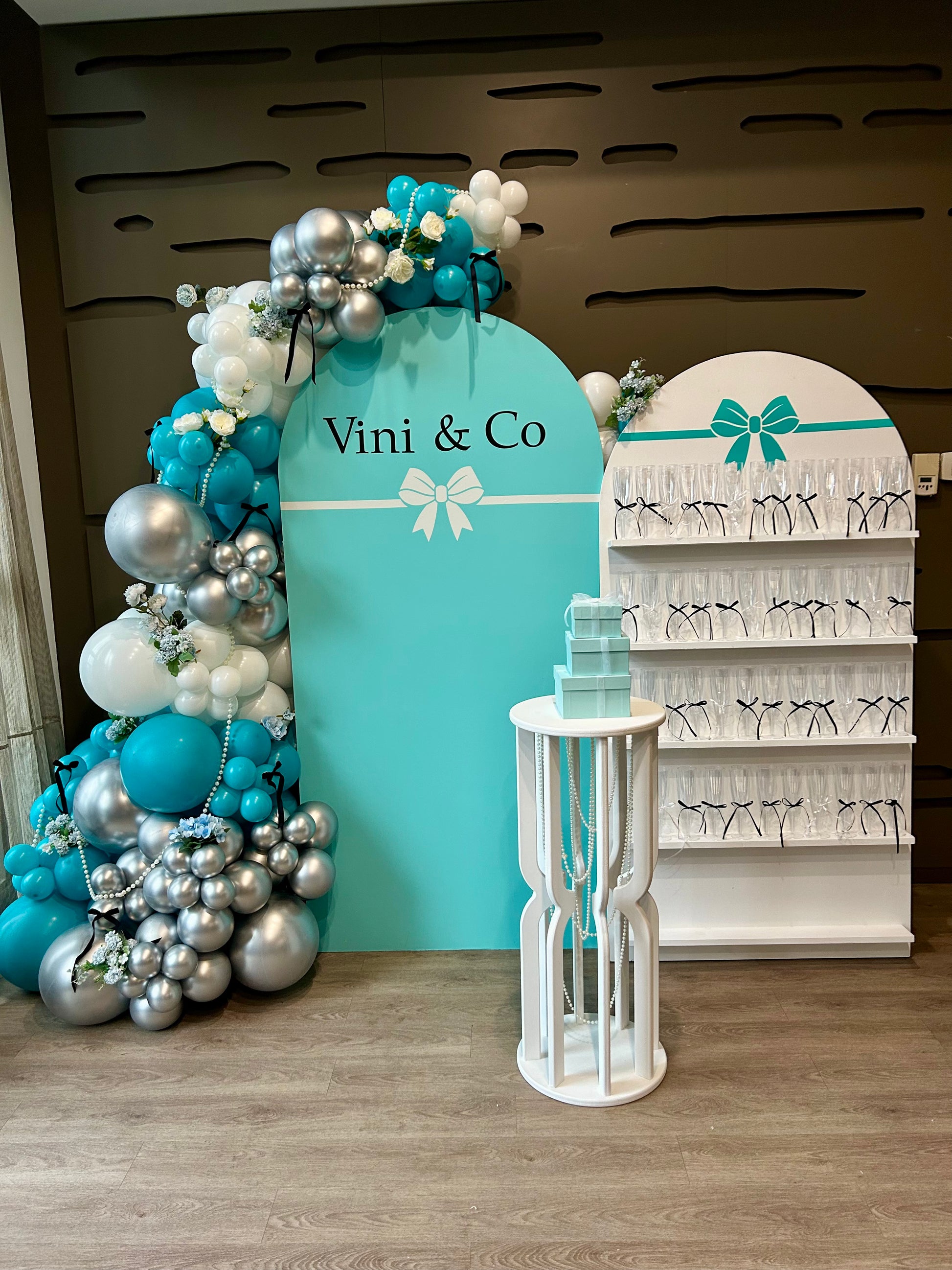 tiffany inspired birthday backdrop with champagne wall and balloon garland
