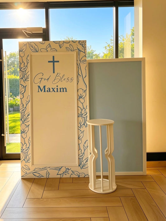  Classic blue baptism backdrop with personalized white backdrop, soft blue panel, custom name sign and white cake pedestal.