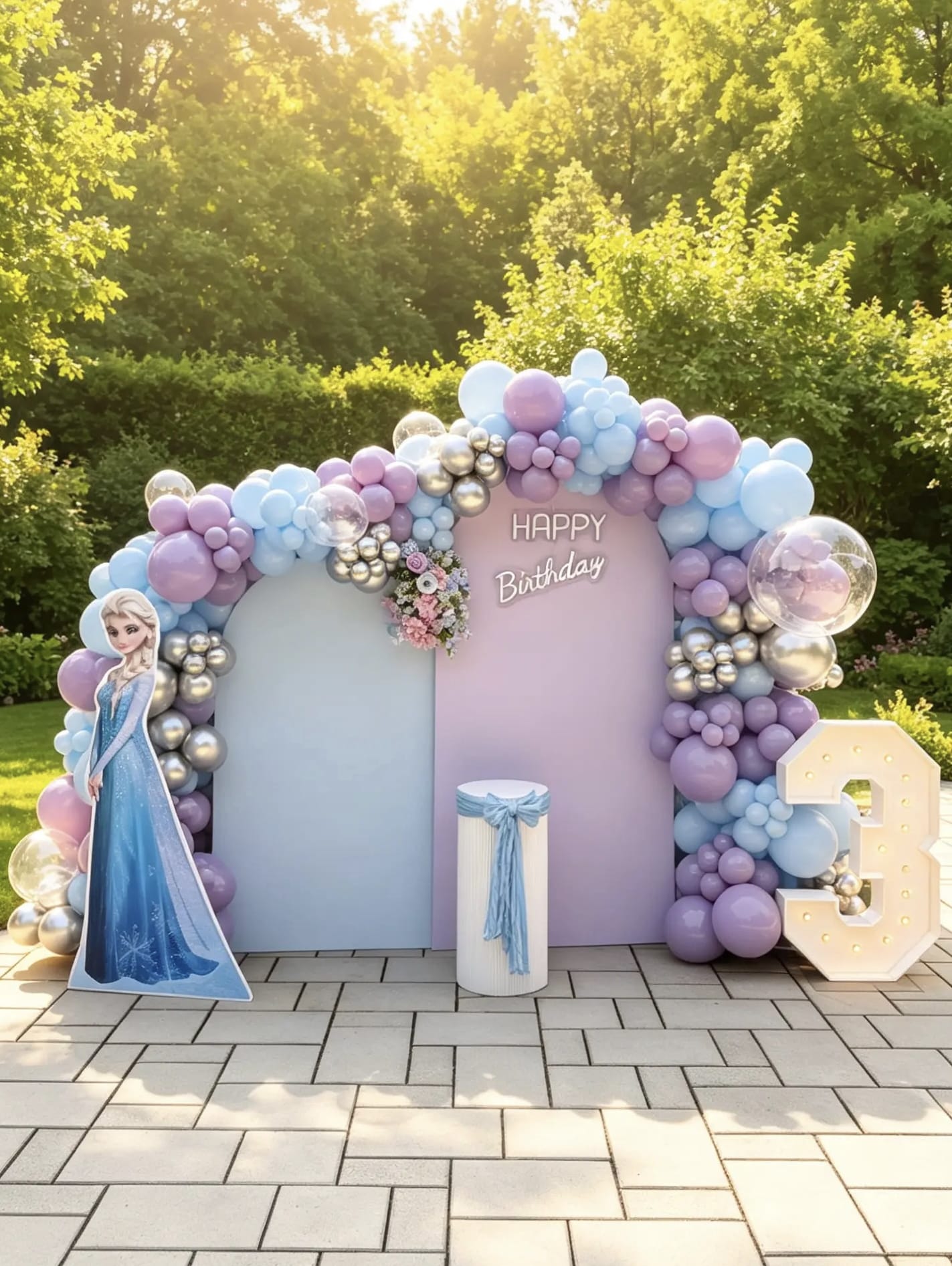 Frozen birthday backdrop with pastel blue, lavender and pink balloon garland, Elsa character cutout, custom birthday sign and light-up marquee number.