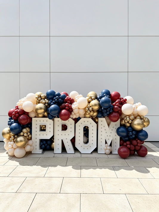 Illuminated PROM marquee letters with navy blue, burgundy red, ivory and gold organic balloon garland