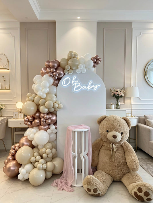 blush teddy baby shower backdrop with rose gold balloon garland and teddy bear