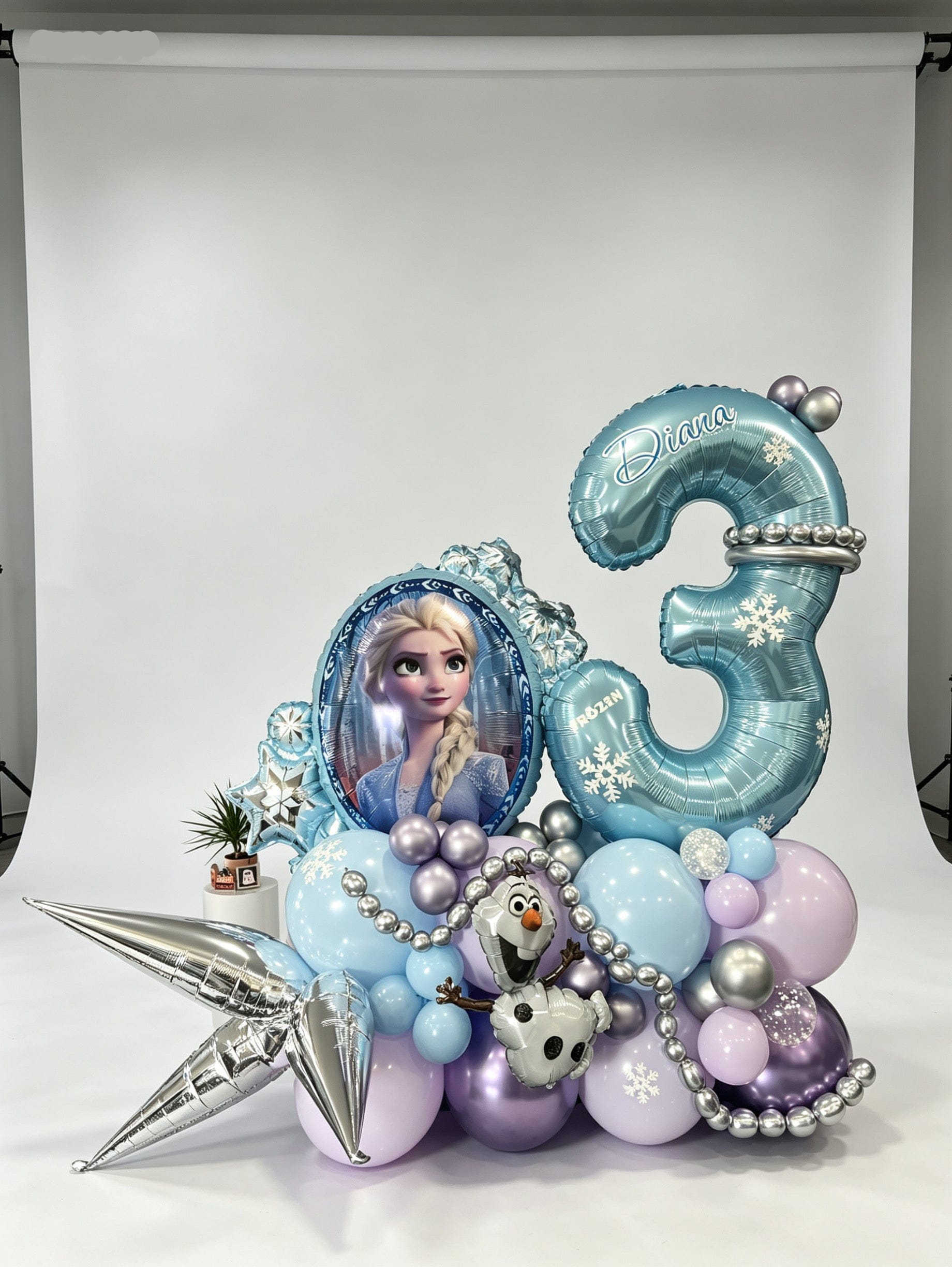 frozen themed birthday balloon stand with number and character balloon