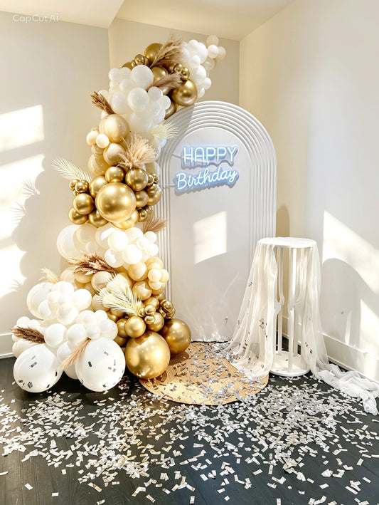 neutral luxury birthday backdrop with pampas balloon garland and ripple panels
