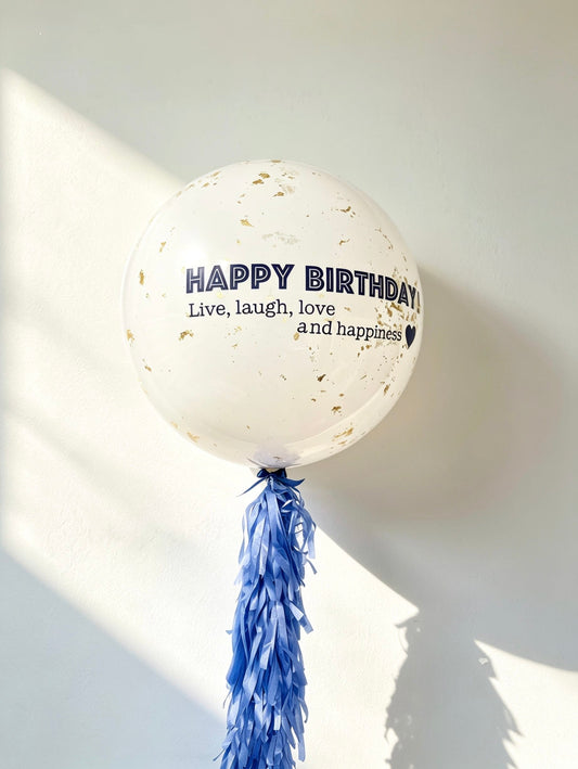 custom glass effect jumbo birthday balloon with gold confetti and blue tassel tail