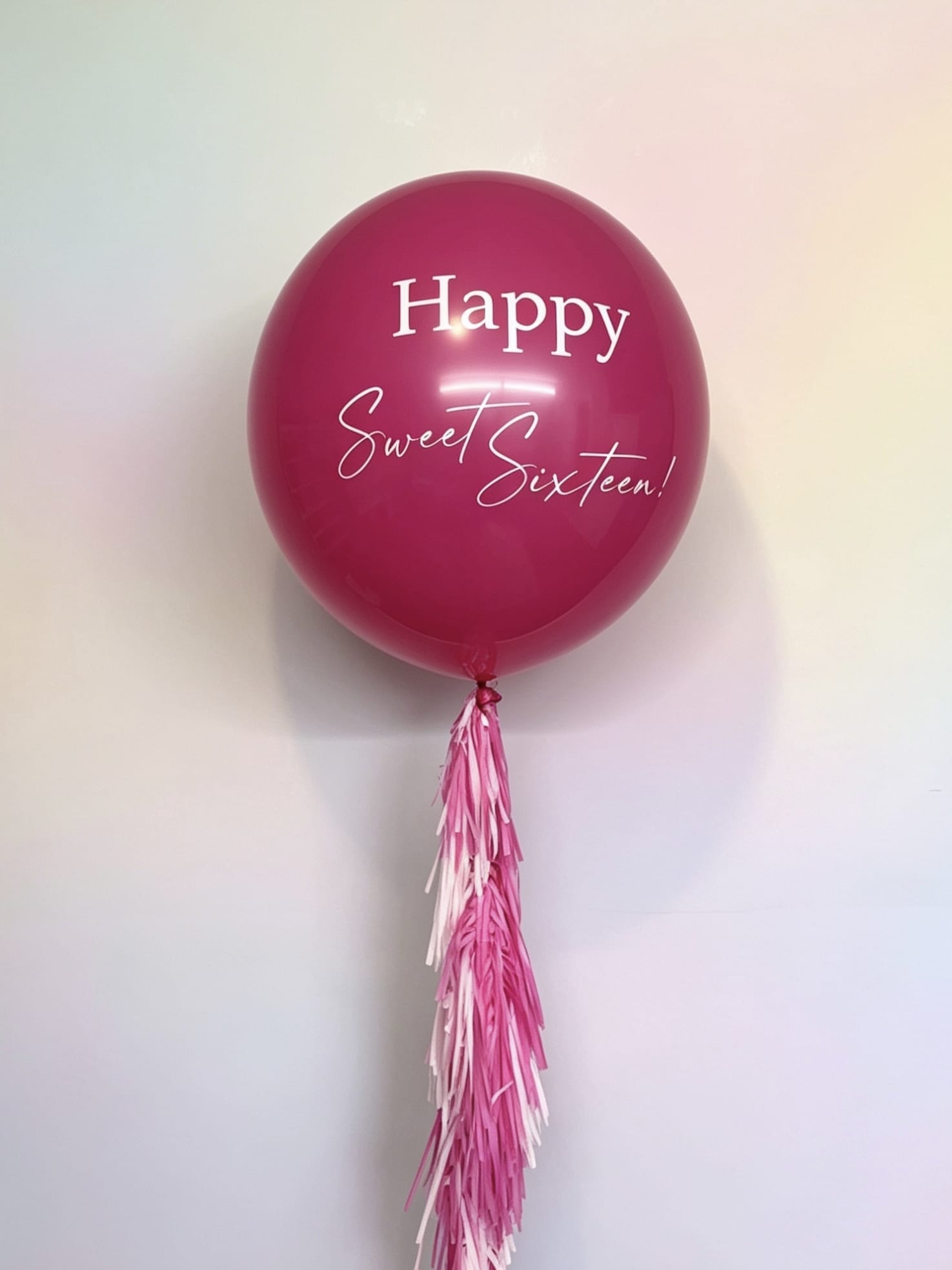 pink 3 ft jumbo balloon with sweet sixteen custom lettering and tassel tail