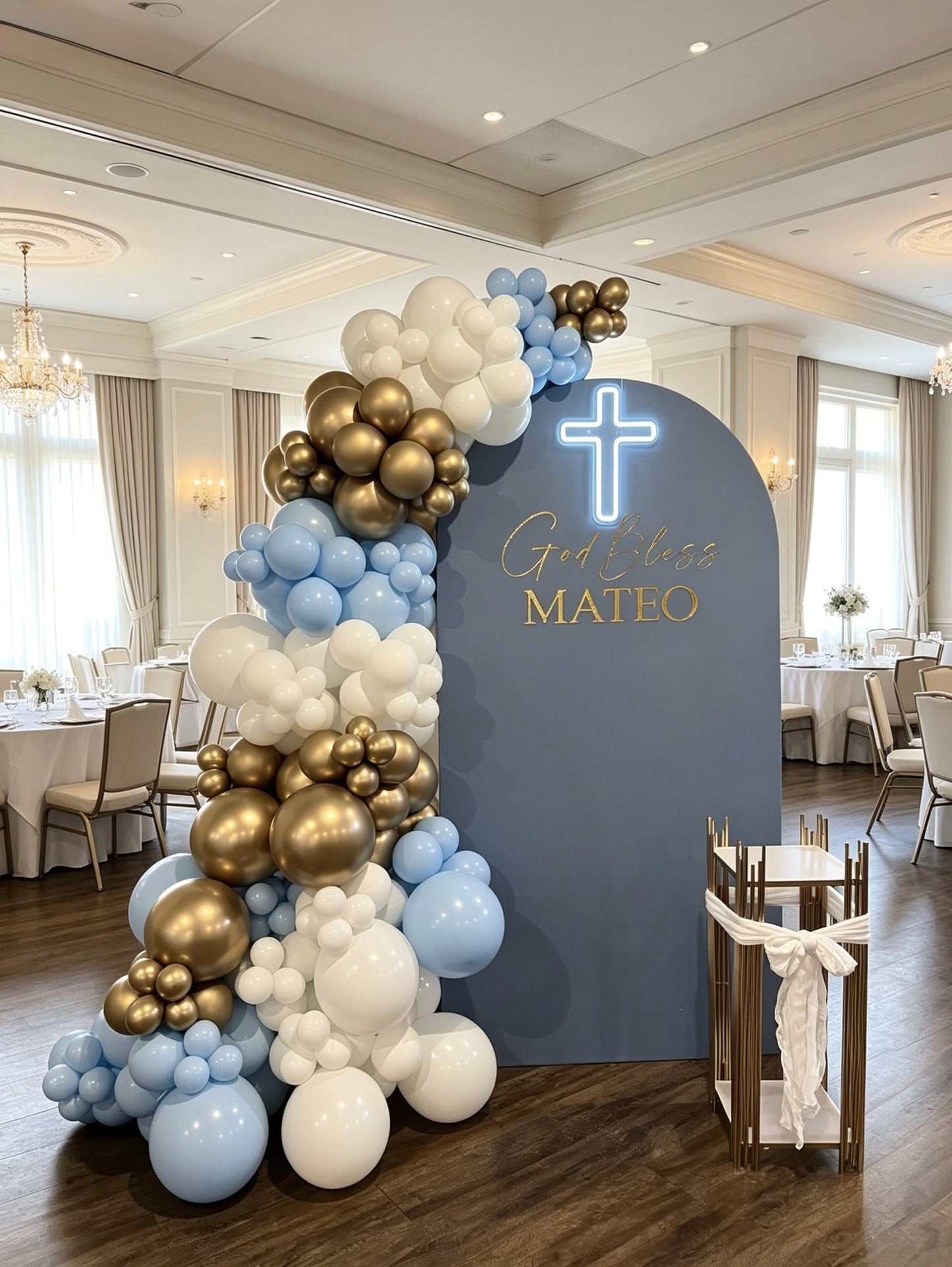 blue baptism backdrop with illuminated cross and luxury balloon garland