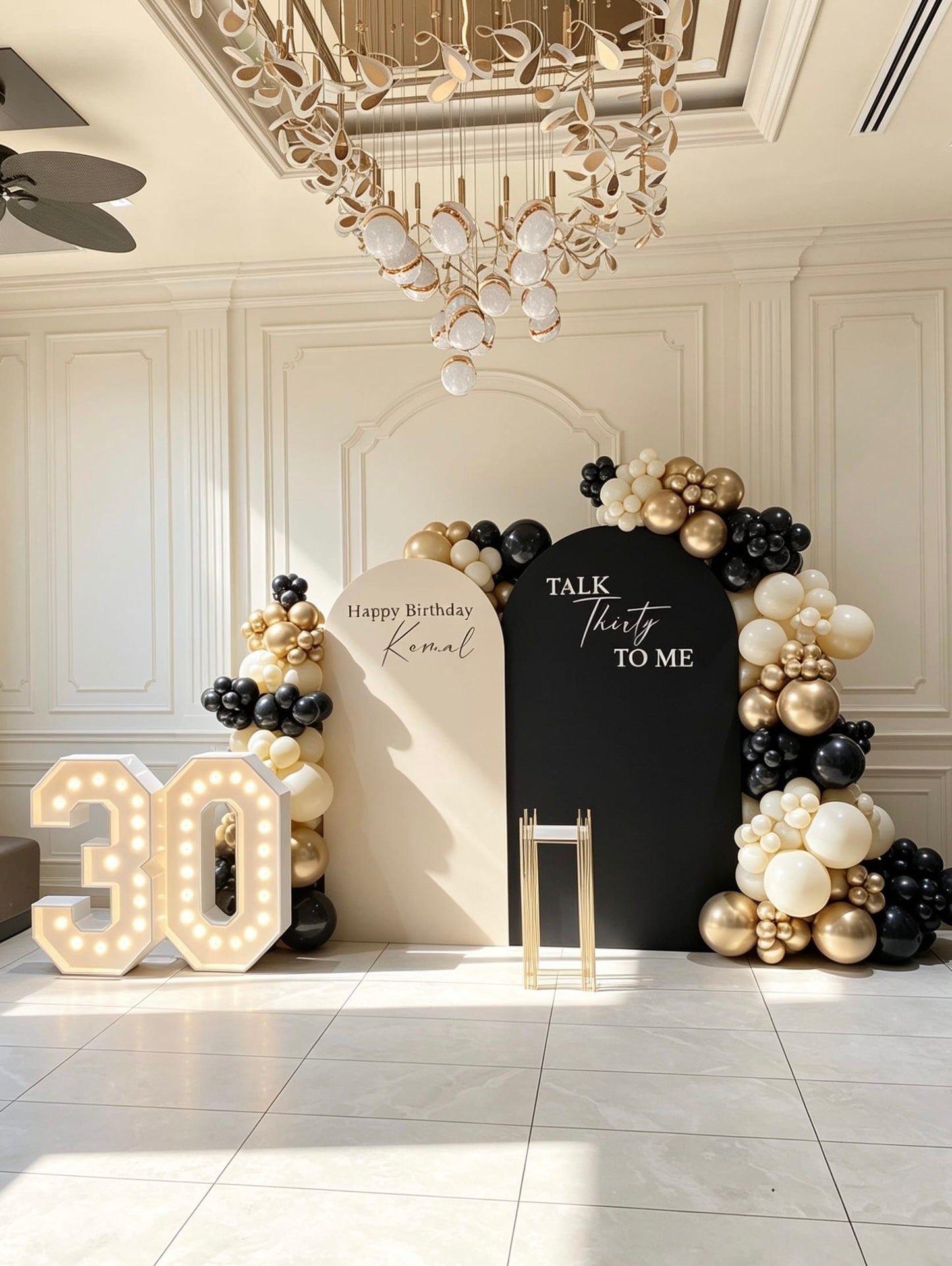 luxury black gold and ivory 30th birthday backdrop with marquee numbers and balloon garlands