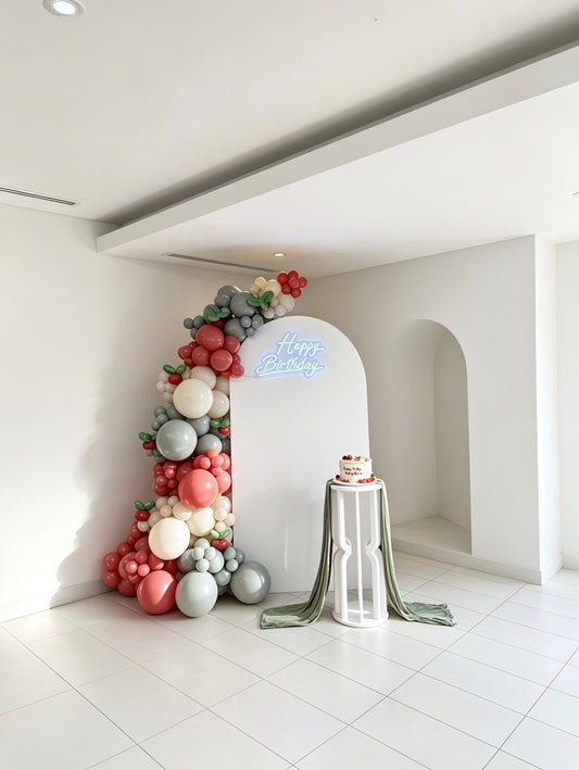 tomato inspired birthday backdrop with red sage and ivory balloons