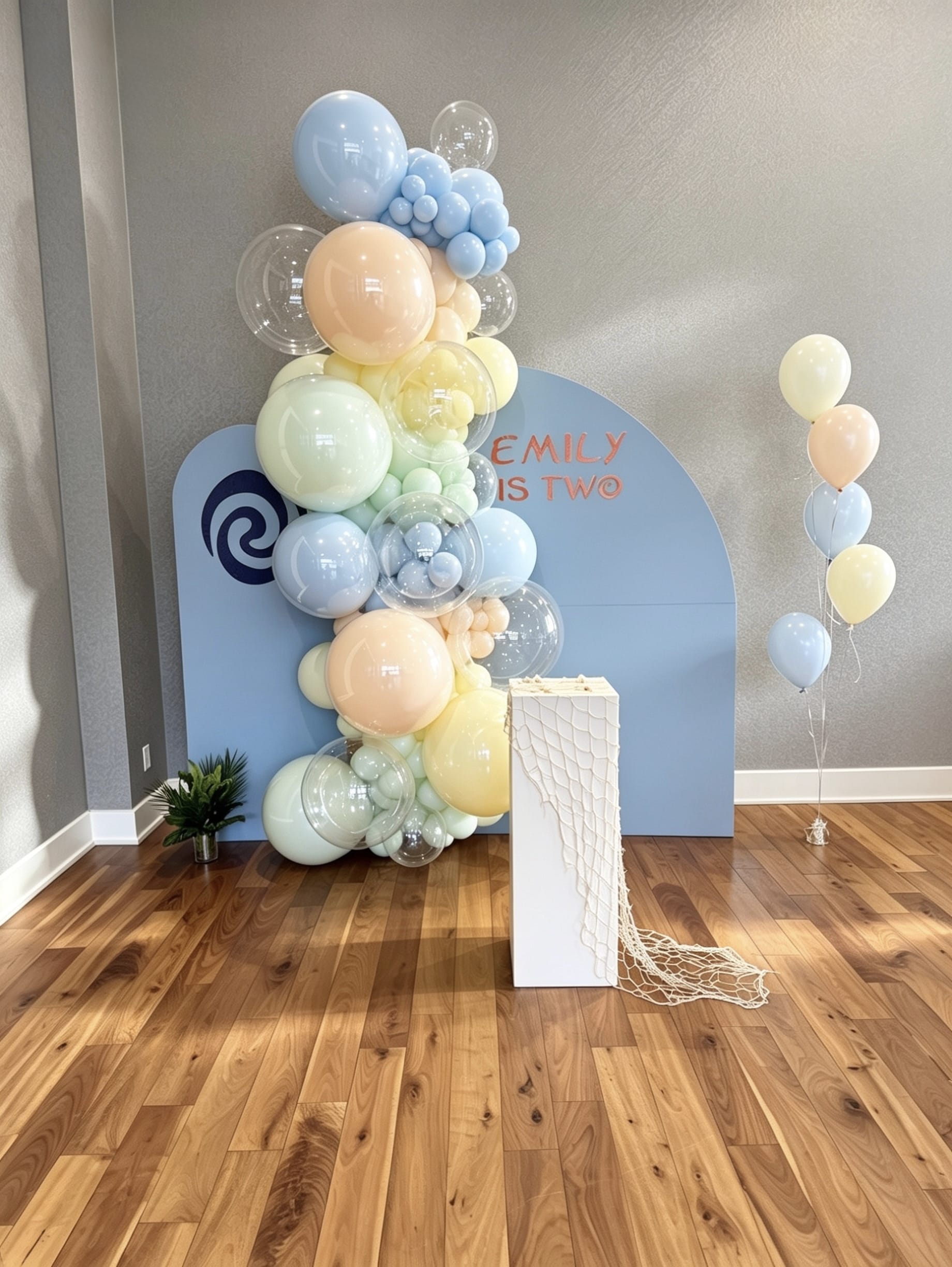 pastel moana birthday backdrop with pastel balloon garland and bubble balloons